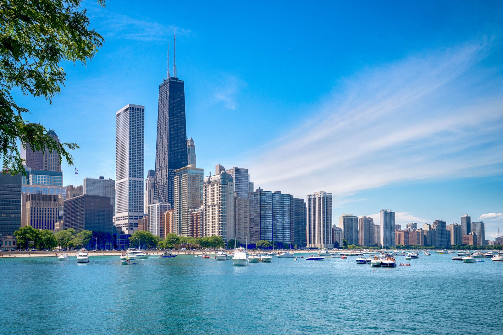 Chicago skyline from lake with boats