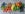 Fresh vegetables, fruits, and nuts on gray background