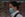 A woman wearing a facemask as a preventive measure against the COVID-19 novel coronavirus walks in front of a screen showing international departures at Shanghai Pudong International Airport in Shanghai 26, 2020. (Photo by Hector RETAMAL / AFP) (Photo by HECTOR RETAMAL/AFP via Getty Images)