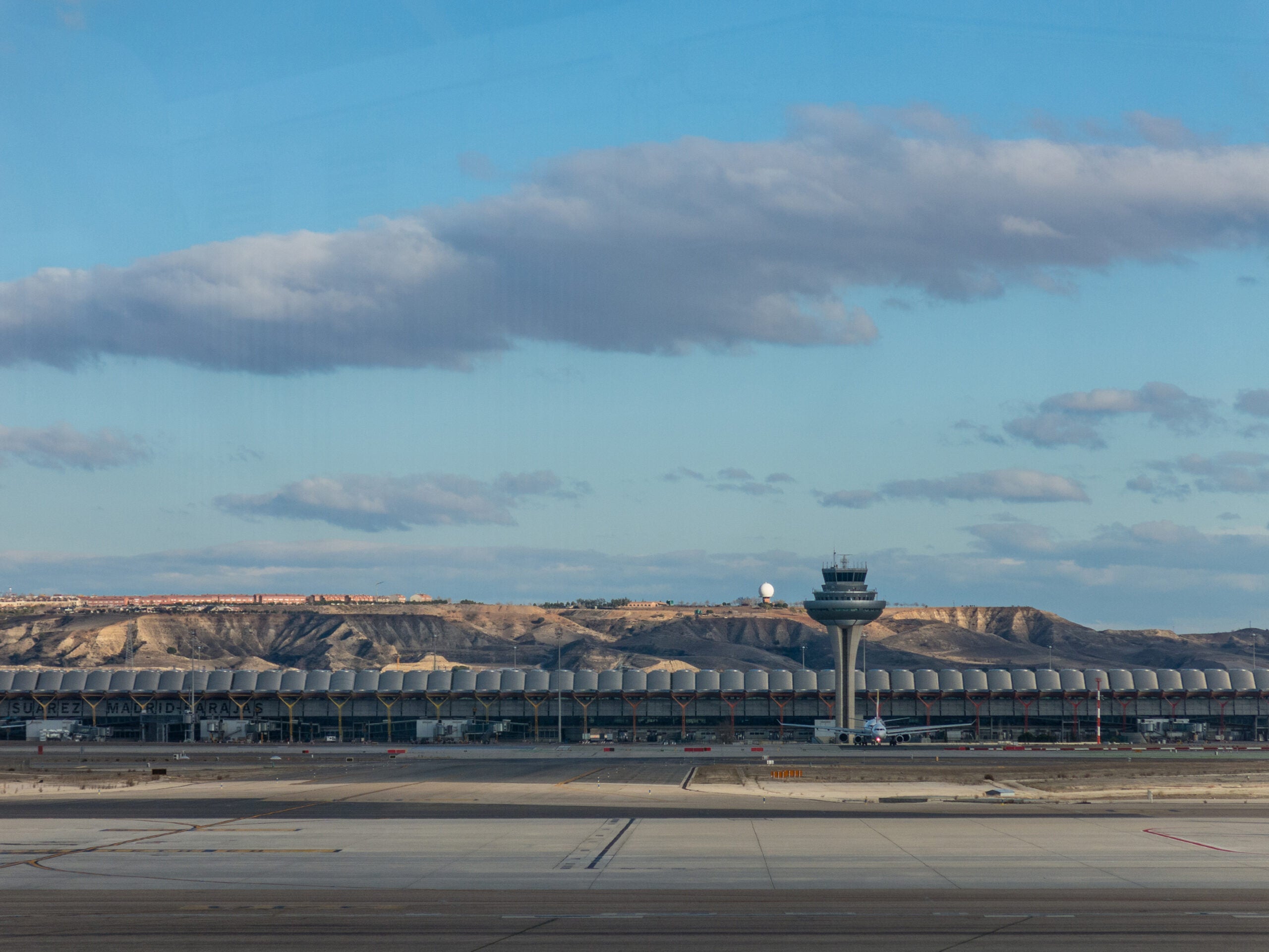 A plane prepares to take off on the runway of Terminal T4 the Adolfo Suarez Madrid Barajas Airport. Barajas is the main international airport serving Madrid in Spain.