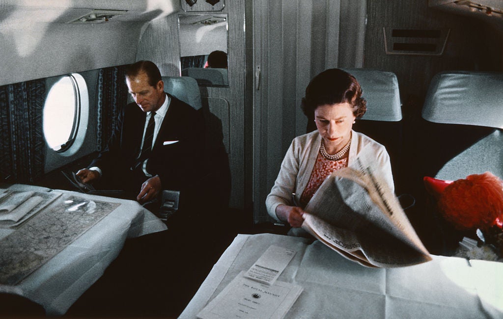 Prince Philip and Queen Elizabeth board the plane