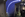 The blue-lit stairway toward the front of the plane