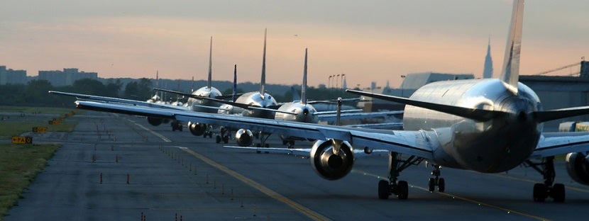 Airplanes line on runway banner shutterstock 1826627