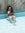 My cousin Hana, limonada de coco in hand, demonstating how to get the most from the pool area.