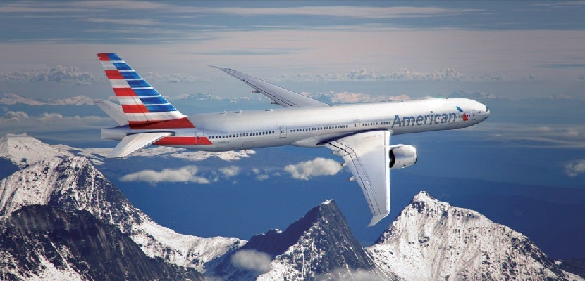 American Airlines plane over mountains featured