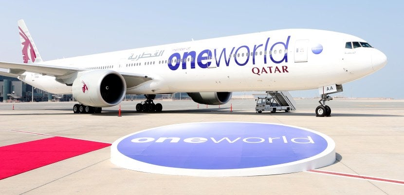 Qatar aircraft in oneworld livery on tarmac in front of orb, red carpet featured 830x400
