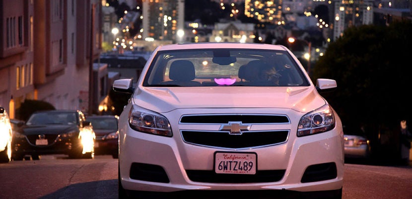 Lyft At Its San Francisco Headquarters Showcasing Lyft Cars, The Glowstache, The Lyft App, Lyft Passengers And Drivers
