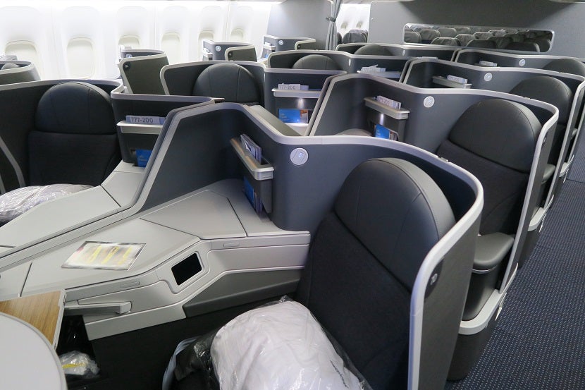 aa-777-200-772-new-retrofit-business-class-middle-seats-with-economy-in-background