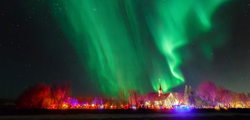 Iceland, Reykjavik, Aurora borealis over church