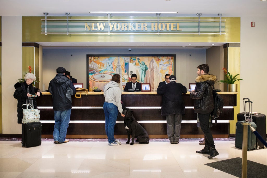 Dogs And Their Owners Check Into Their Hotels For The Westminster Dog Show.