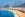 Photo of Copacabana Beach, the ocean and the cityscape of Rio de Janeiro, during summer in Brazil.