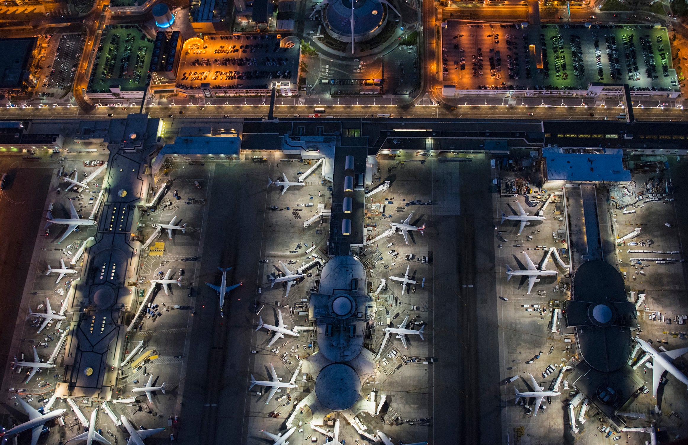 Aerial view of airplanes parked in airport gates