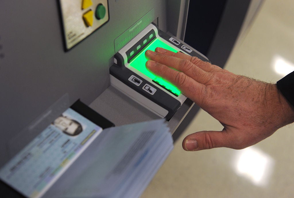 Global Entry members insert their passports, have their photograph taken and the fingerprints scanned as part of the entry process. (Photo by Katherine Frey / The Washington Post / Getty Images)