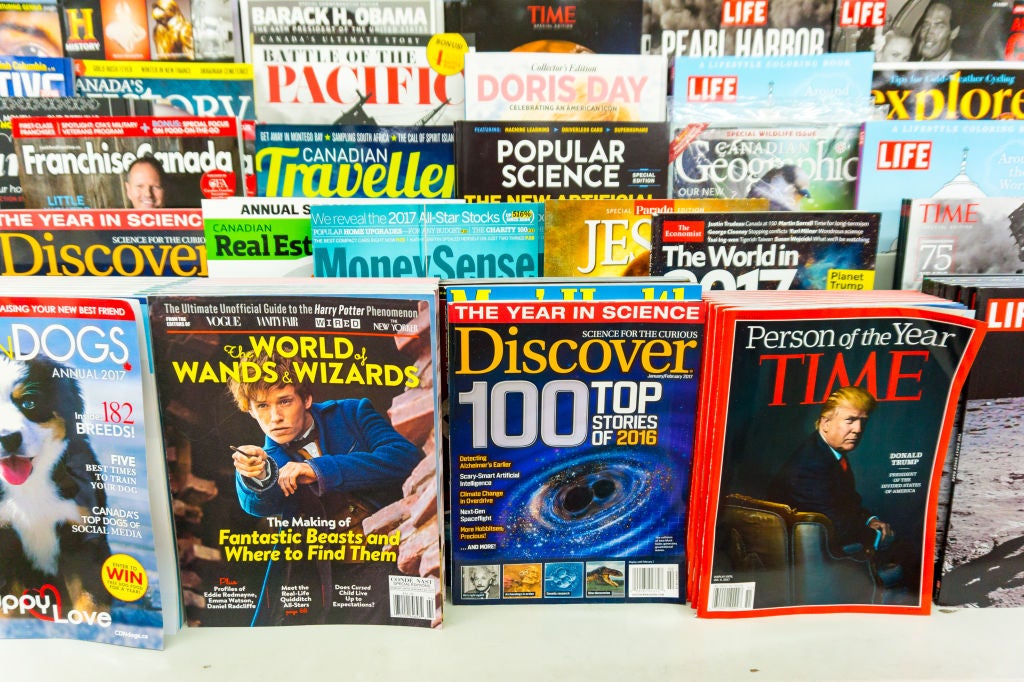 Magazines on display shelf for sale. Treasure of knowledge