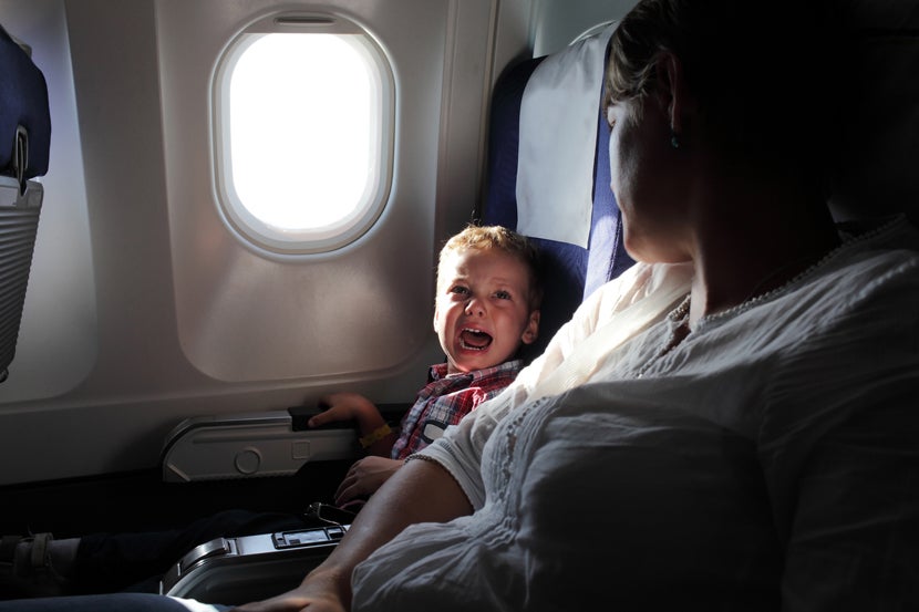 Crying boy on plane