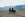 Rear view on two people on their horse back at Hvalfjörður in the West Region of Iceland
