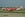 Can you spot the golfers behind the AirAsia plane? Image courtesy of Alec Wilson/Wikipedia.