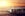 Plane in airport on sunset background.