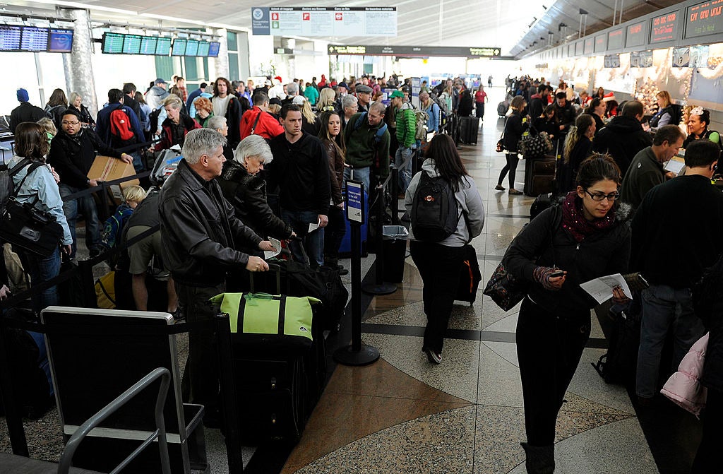 Holiday travelers make their way through a busy Southwest Airline check in, Wednesday, December 21, 2011, at Denver International Airport. Between today and next Monday DIA will see over a million travelers. The Kobernusz family, from Denver, are heading
