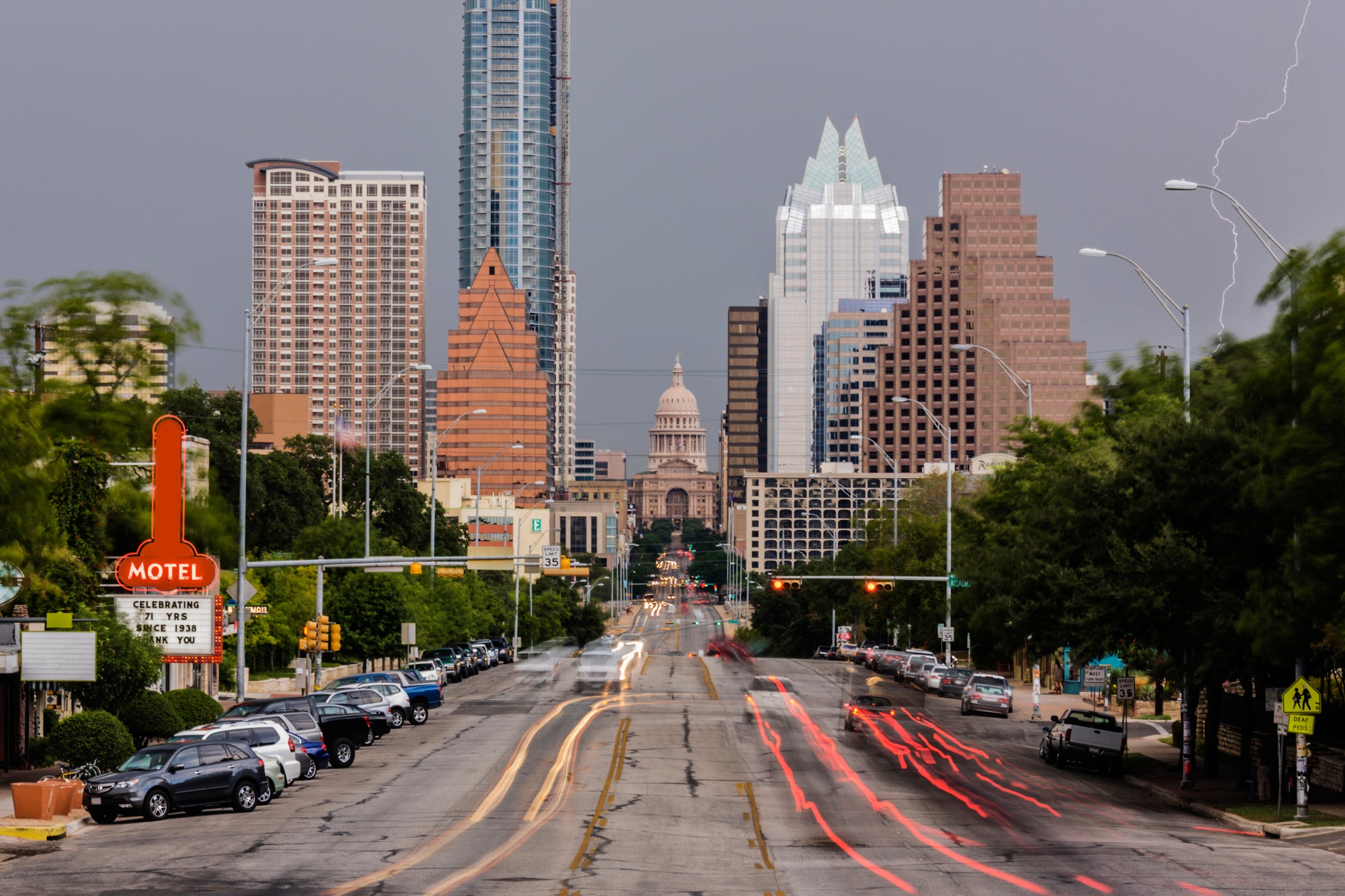 Blurred motion view of cars driving in Austin cityscape, Texas, United States