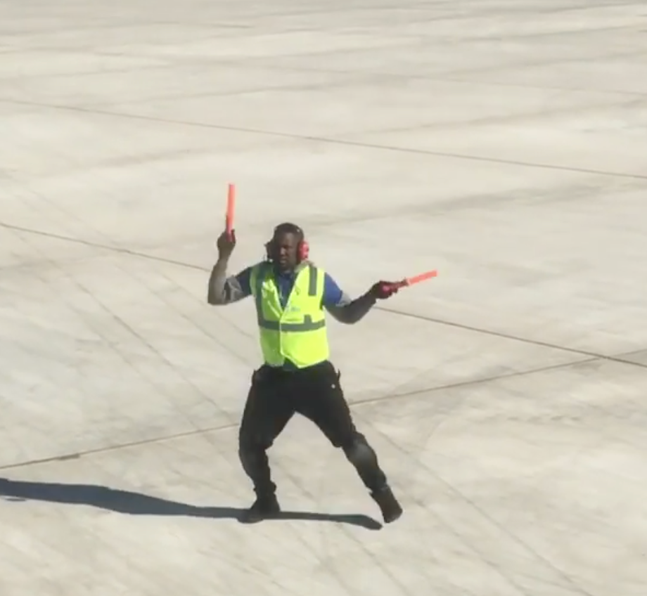 Watch This Airport Worker Dance on the Tarmac