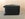 You can clearly see scuffs on the underside of the suitcase.