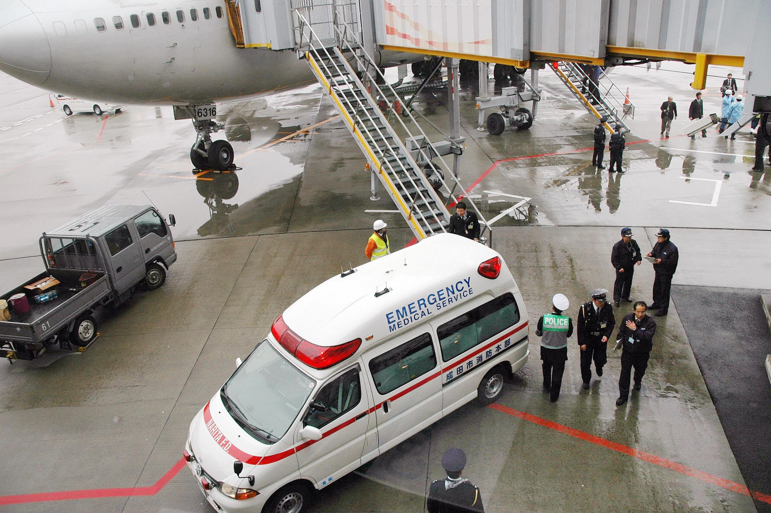 An ambulance waits for injured passenger