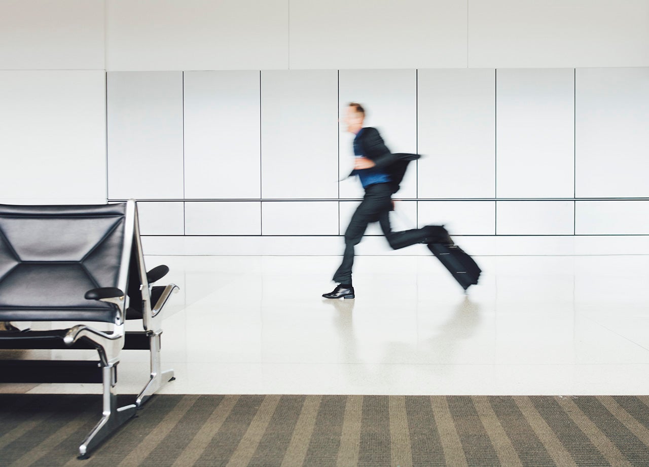 Businessman running with suitcase