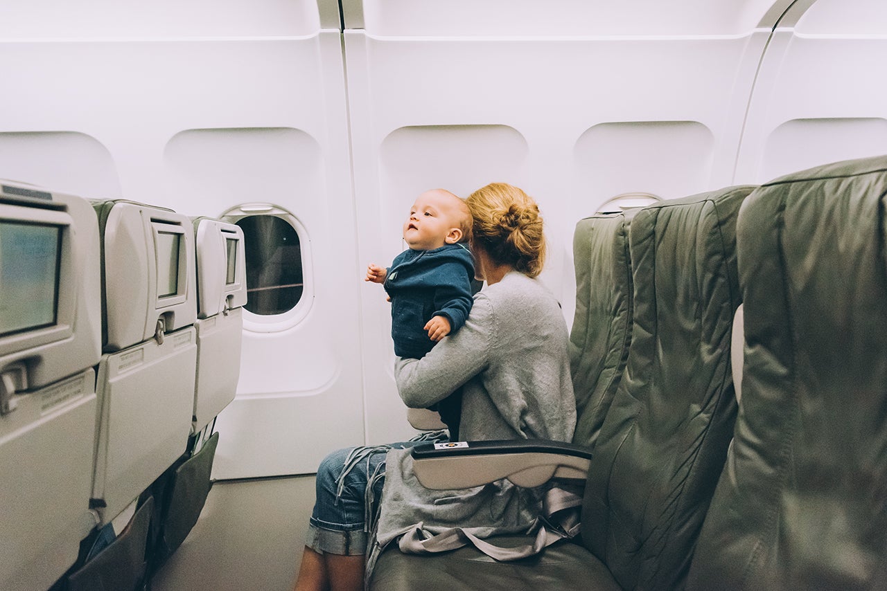 Woman traveling with her baby