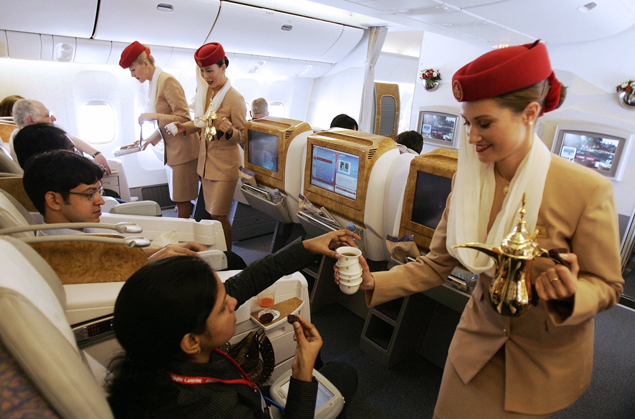 Emirates Airlines flight attendants serv