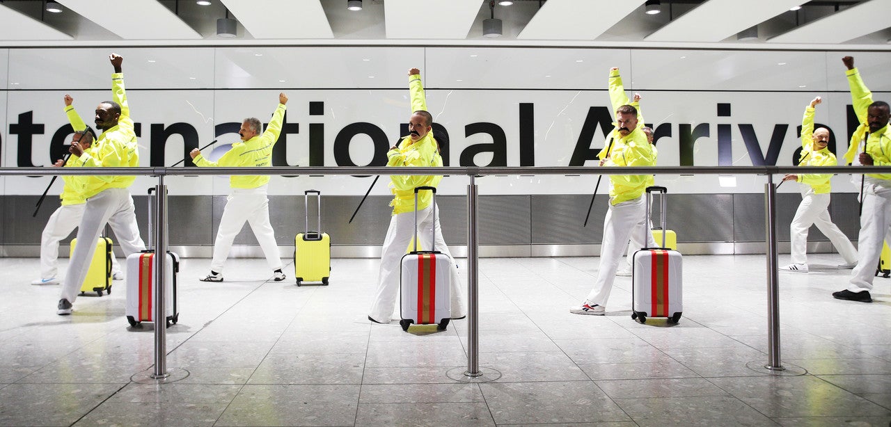 Baggage handlers perform tributes to Freddie Mercury, Heathrow, UK, 4th September 2018
