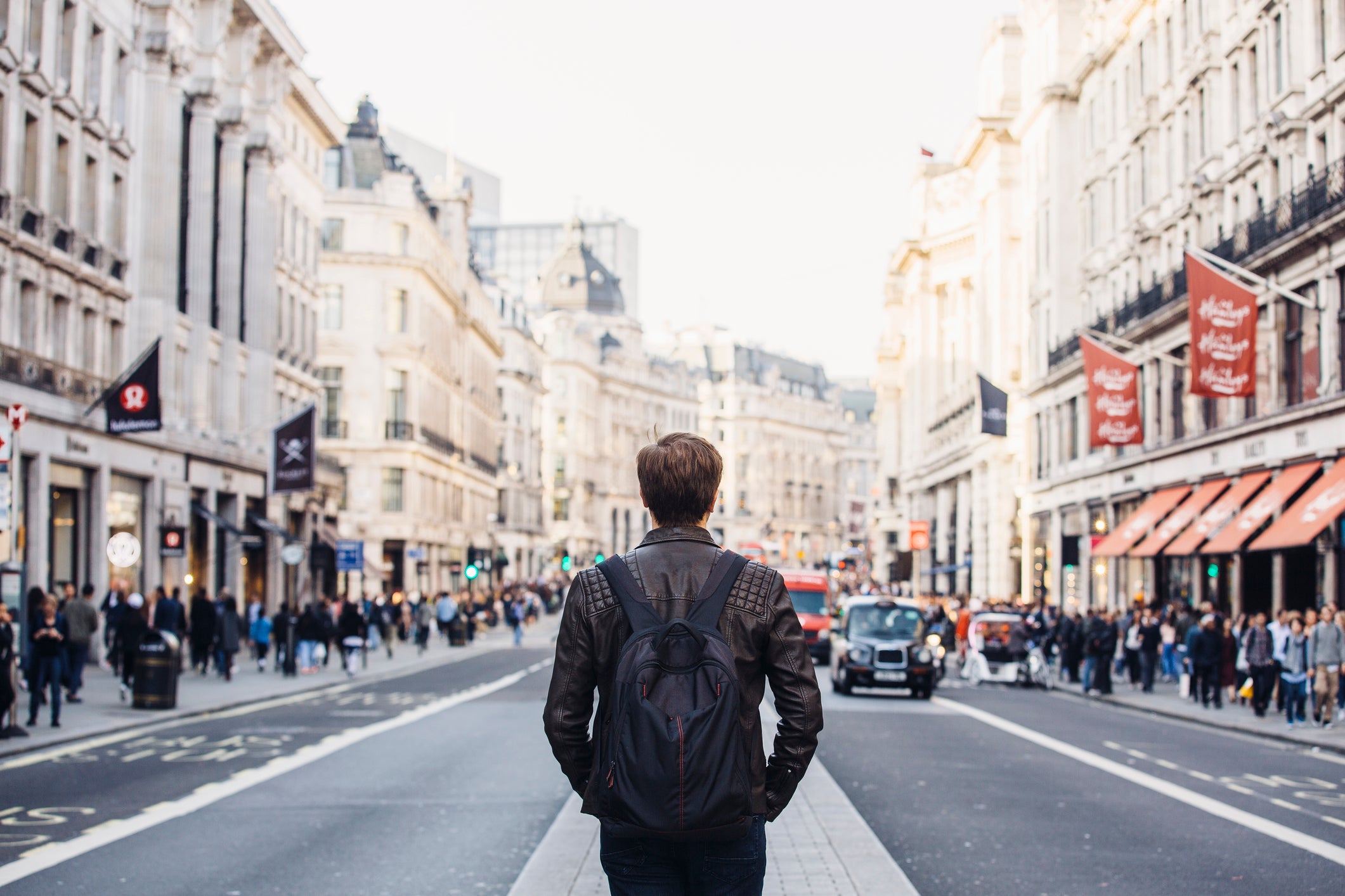philippines travel diarrhea Tourist with backpack walking on Regent Street in London, UK