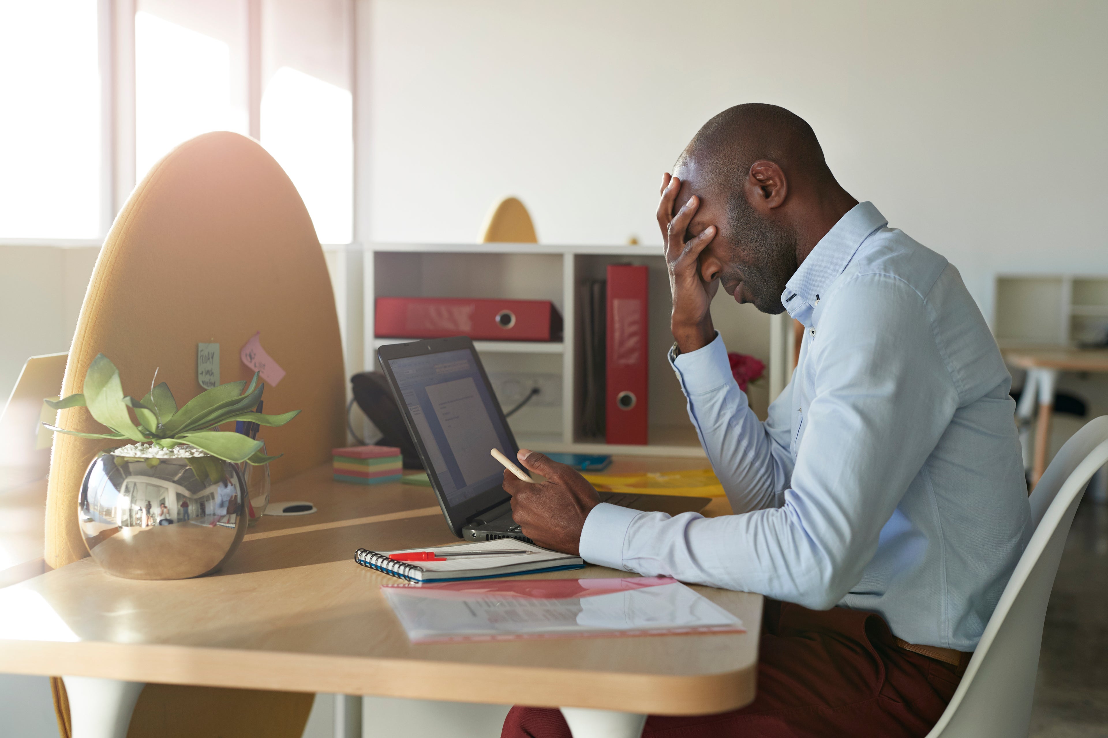 Businessman sitting at office desk