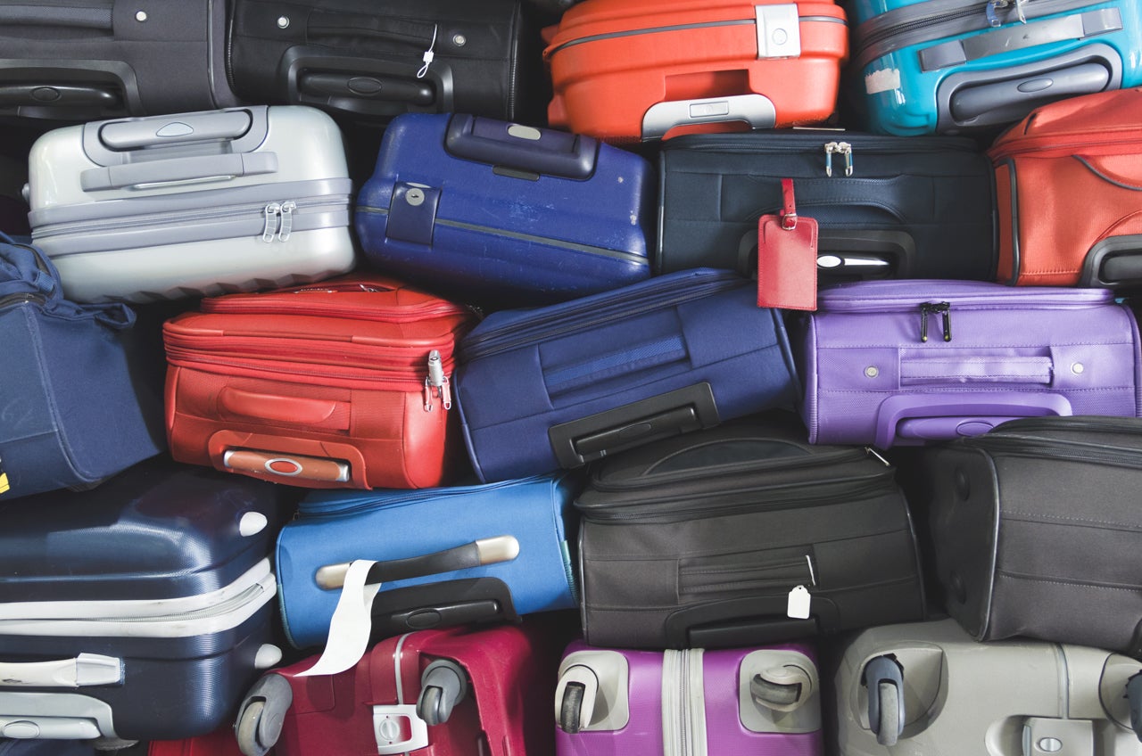 pile of suitcases_photo via shutterstock