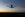 A 787 jet airplane lands at San Diego International Airport at sunset.