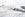 Horizontal color image of airplane during snowstorm.