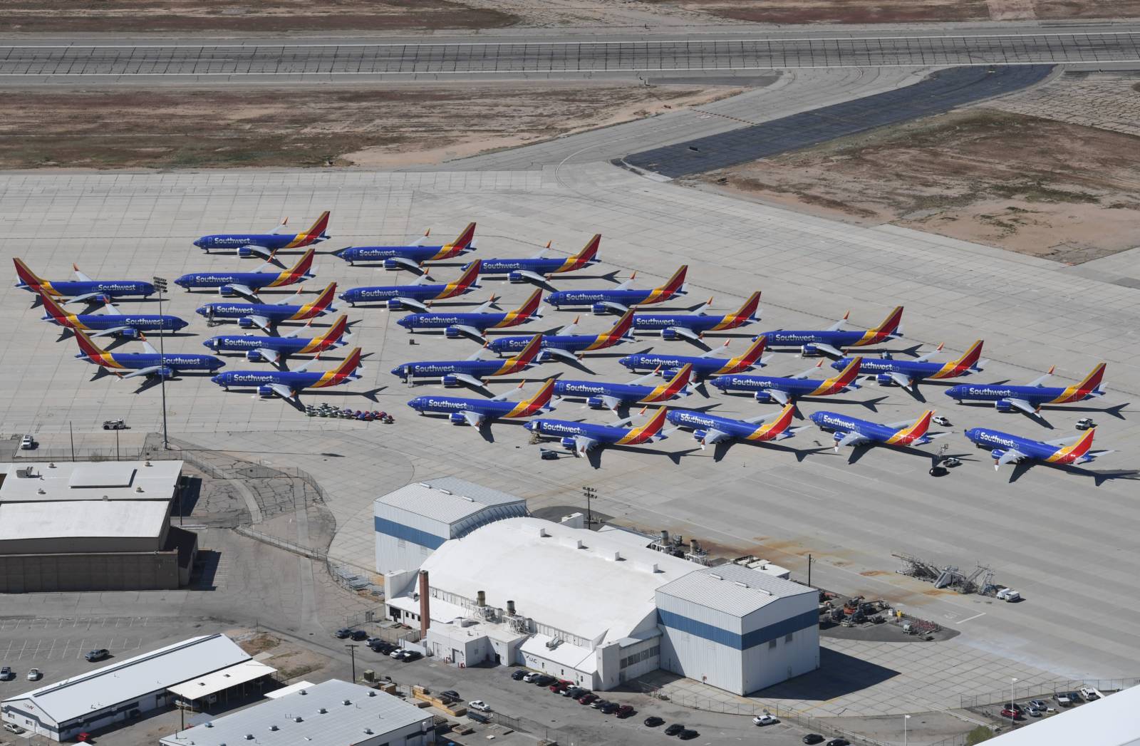 Southwest Airlines Boeing 737 MAX aircraft are parked on the tarmac after being grounded, at the Southern California Logistics Airport in Victorville, California on March 28, 2019. - After two fatal crashes in five months, Boeing is trying hard -- very hard -- to present itself as unfazed by the crisis that surrounds the company. The company's sprawling factory in Renton, Washington is a hive of activity on this sunny Wednesday, March 28, 2019, during a tightly-managed media tour as Boeing tries to communicate confidence that it has nothing to hide. Boeing gathered hundreds of pilots and reporters to unveil the changes to the MCAS stall prevention system, which has been implicated in the crashes in Ethiopia and Indonesia, as part of a charm offensive to restore the company's reputation. (Photo by Mark RALSTON / AFP) (Photo credit should read MARK RALSTON/AFP/Getty Images)
