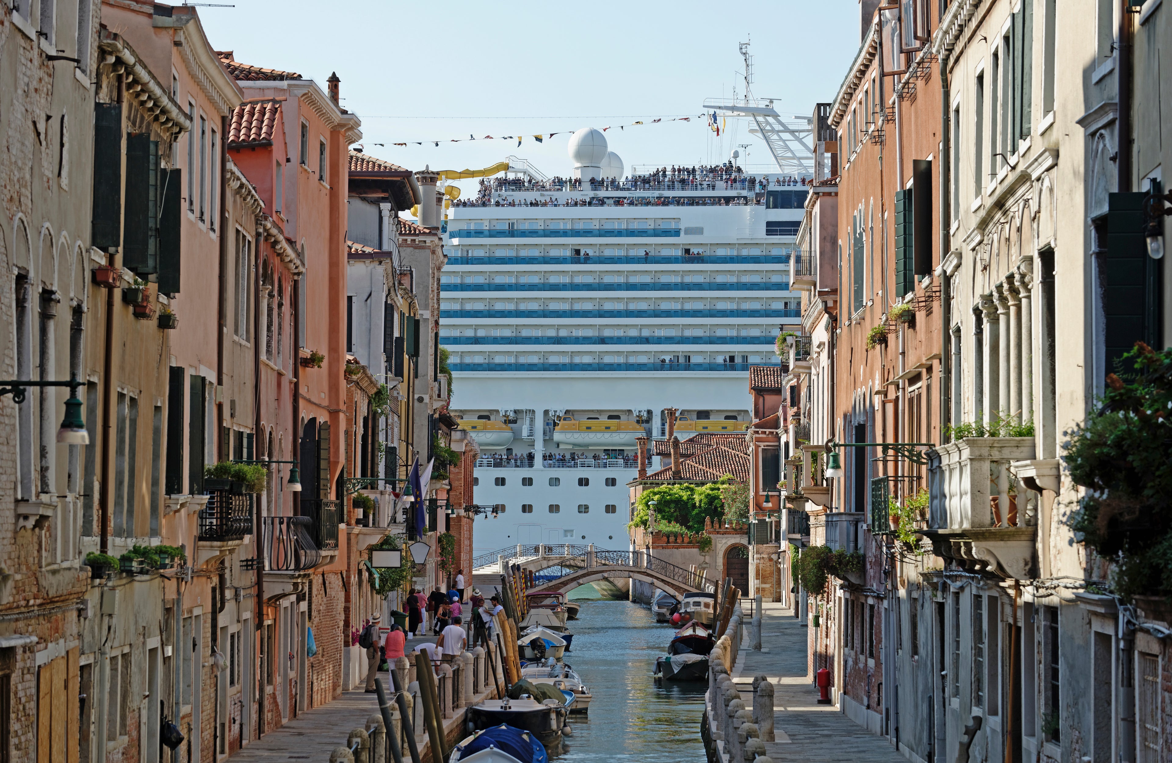 Huge cruise ship seen from canal in city, Venice, Veneto, Italy
