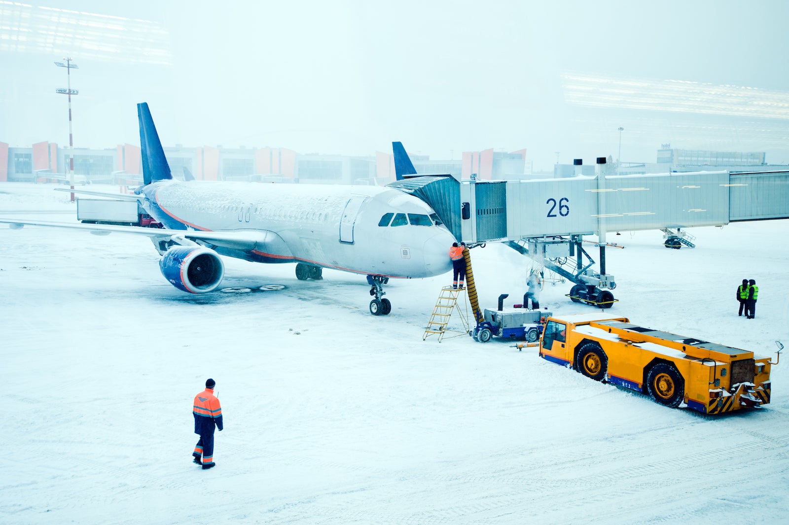 Airplane de-iced after snowstorm. (Photo by ArtMarie / Getty Images)