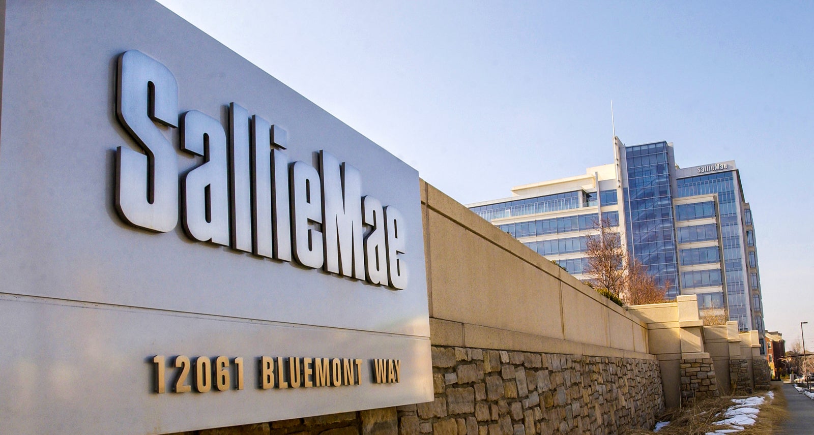 A sign for SLM Corp., also known as Sallie Mae, hangs outsid