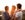 Young gay parents with their daughter having fun in park. Parents holding girl in arms. Enjoying in beautiful sunset. Caucasian ethnicity. (Photo by svetikd/Getty Images)