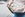 an unidentified person holds and open wallet full of credit cards, cash and a metro pass