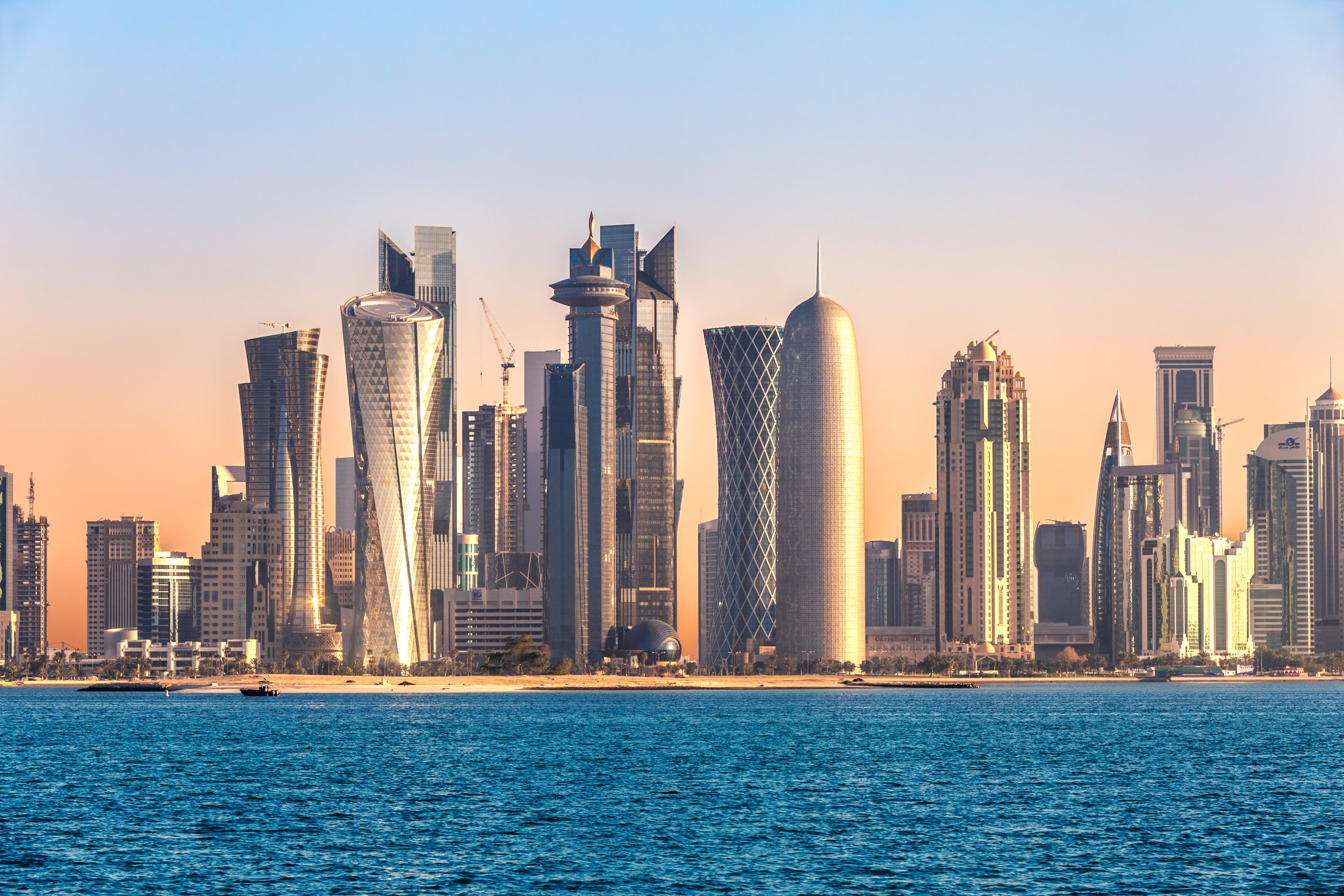Doha skyline and harbor at sunset, Qatar, Middle East