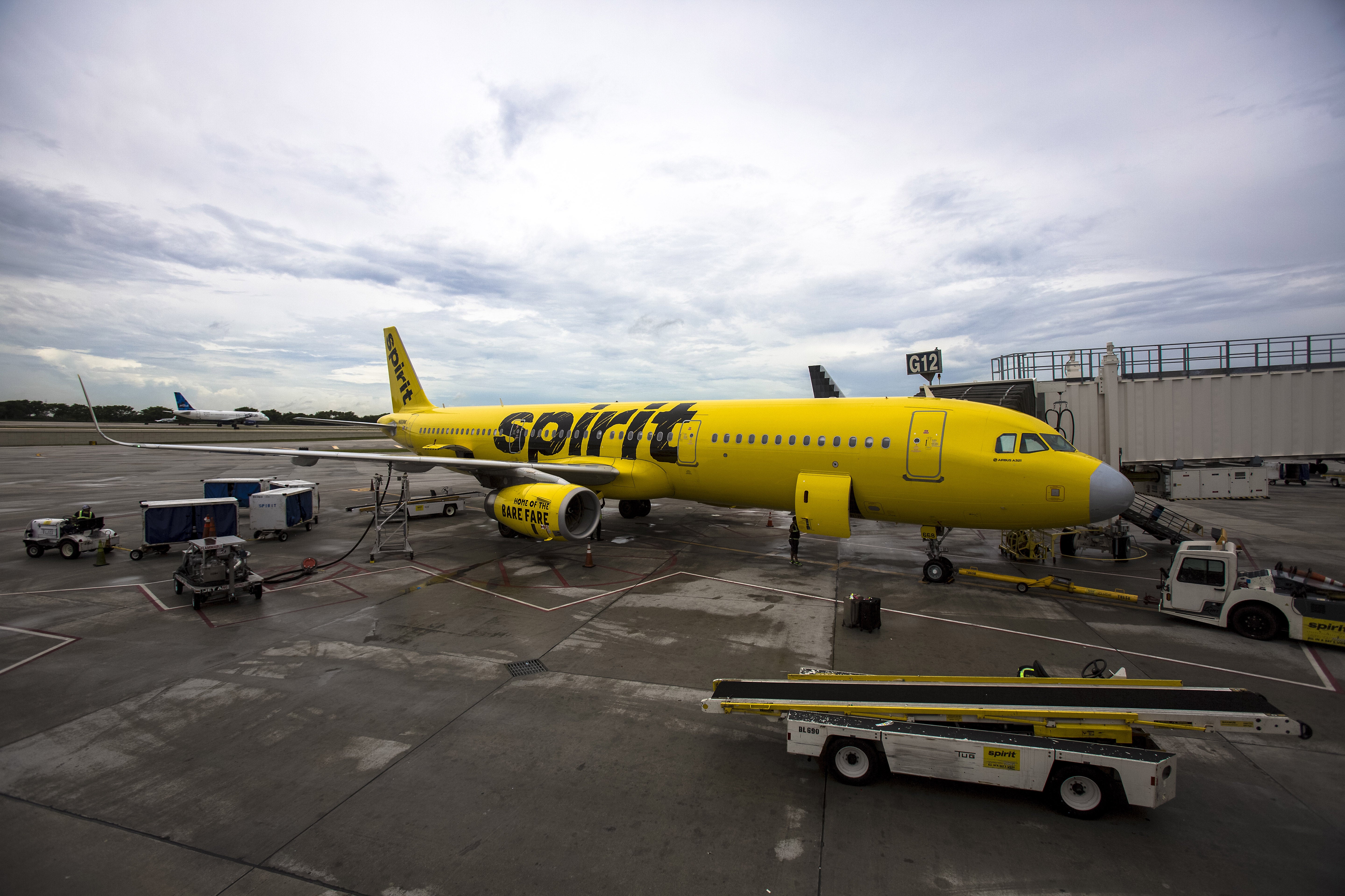 A Spirit Airlines Inc. plane sits on the tarmac at Fort Lauderdale International Airport (FLL) in Fort Lauderdale, Florida, U.S., on Friday, June 2, 2017. Revenue generated from the U.S. accounts for nearly 90 percent of Spirit's revenue. Photographer: Saul Martinez/Bloomberg via Getty Images