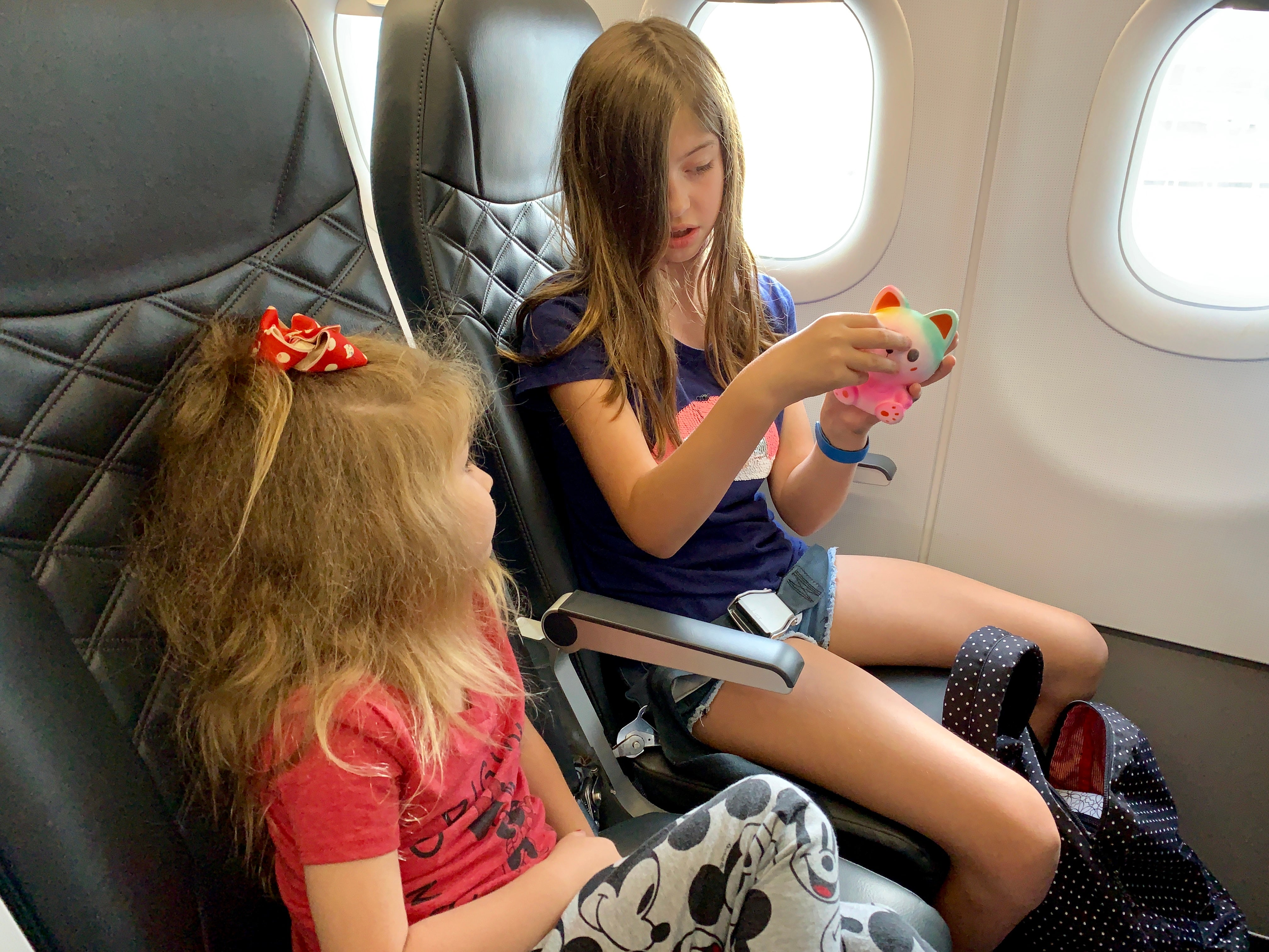 Kids flying on Frontier