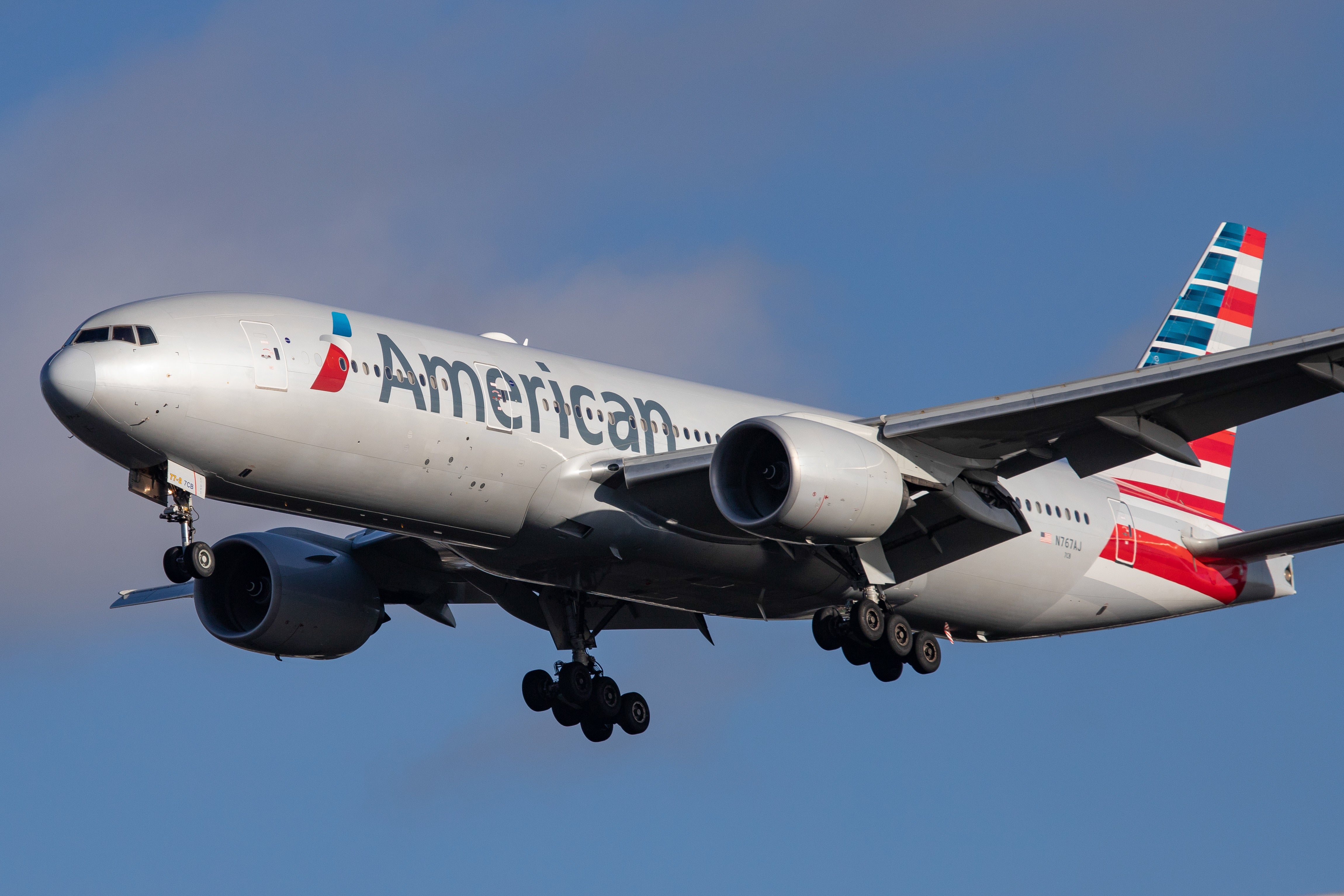 American Airlines Boeing 777-200 aircraft seen flying on final approach, while landing at London Heathrow International Airport. (Photo by Nicolas Economou/NurPhoto via Getty Images)