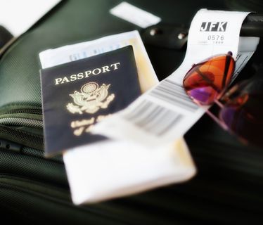 Close up of passport and travel accessories