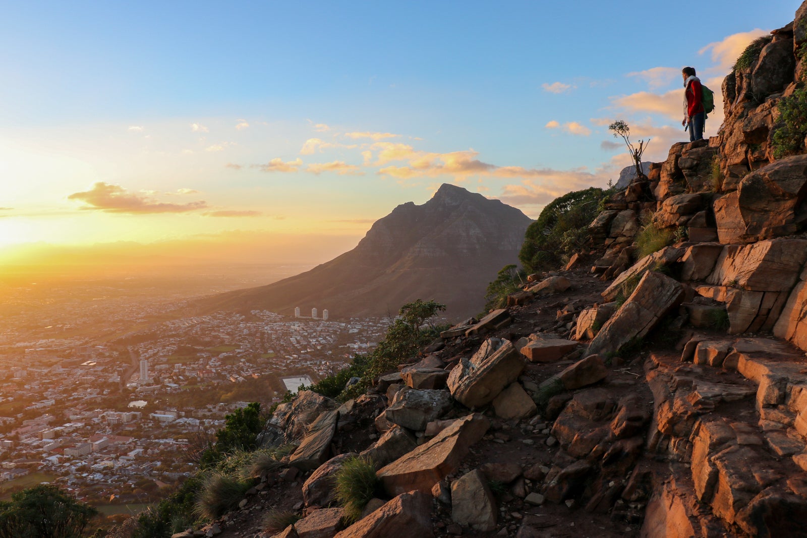 Girl hiking up Lion's Head during sunrise, Cape Town, South Africa