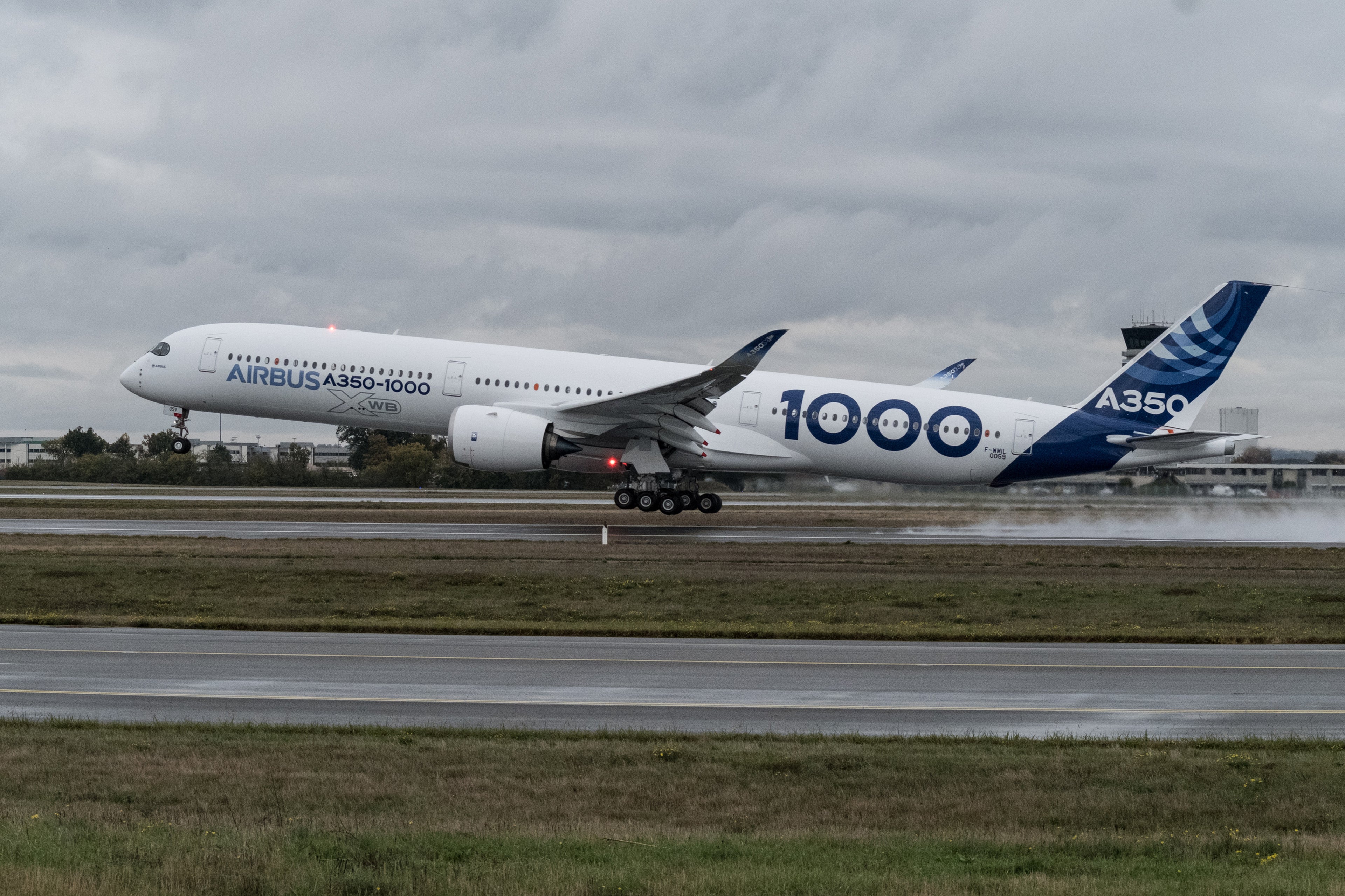 An A350-1000 twinjet passenger plane, manufactured by Airbus Group SE, takes off from the Airbus factory in Toulouse, France, on Thursday, Nov. 24, 2016. The biggest version of Airbus's A350 wide-body jet will make its first flight Thursday, swelling the twin-engine model's capacity and casting further doubt on the future of four-turbine planes including the manufacturer's own A380 and the Boeing Co. 747. Photographer: Balint Porneczi/Bloomberg via Getty Images