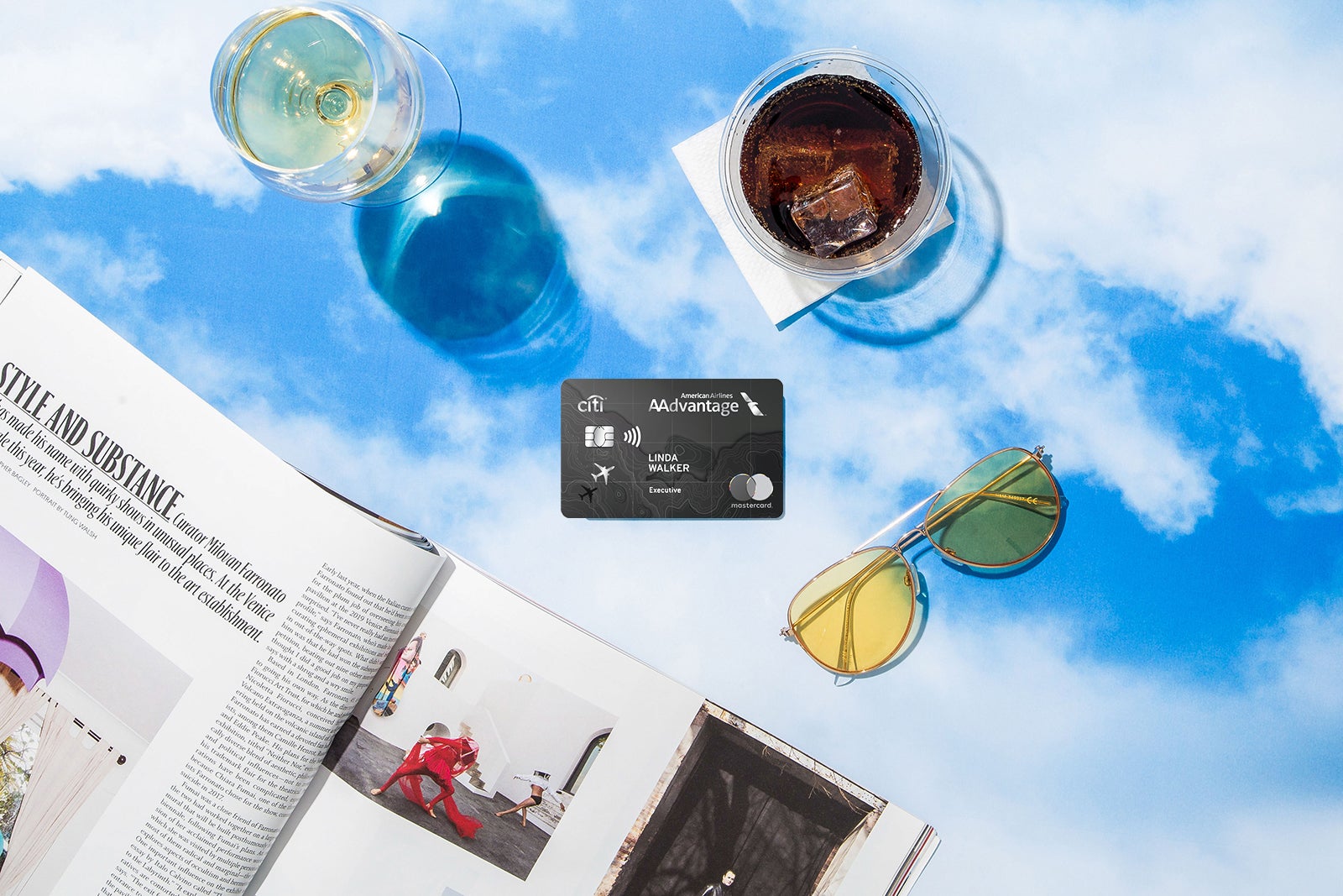 a credit card, sunglasses and magazine